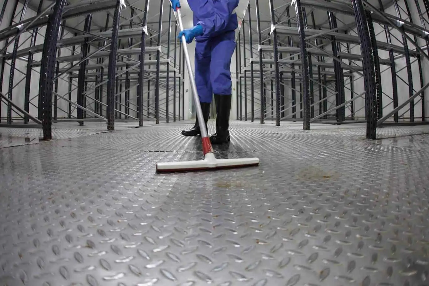 image of janitor cleaning floor